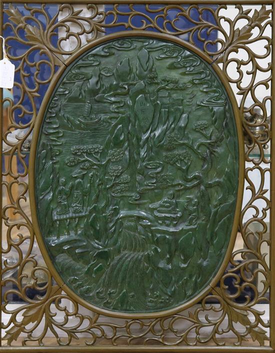 A large Chinese spinach green jade and wood table screen panel, 20th century, total size including wood frame 67 x 53cm, stand lacking